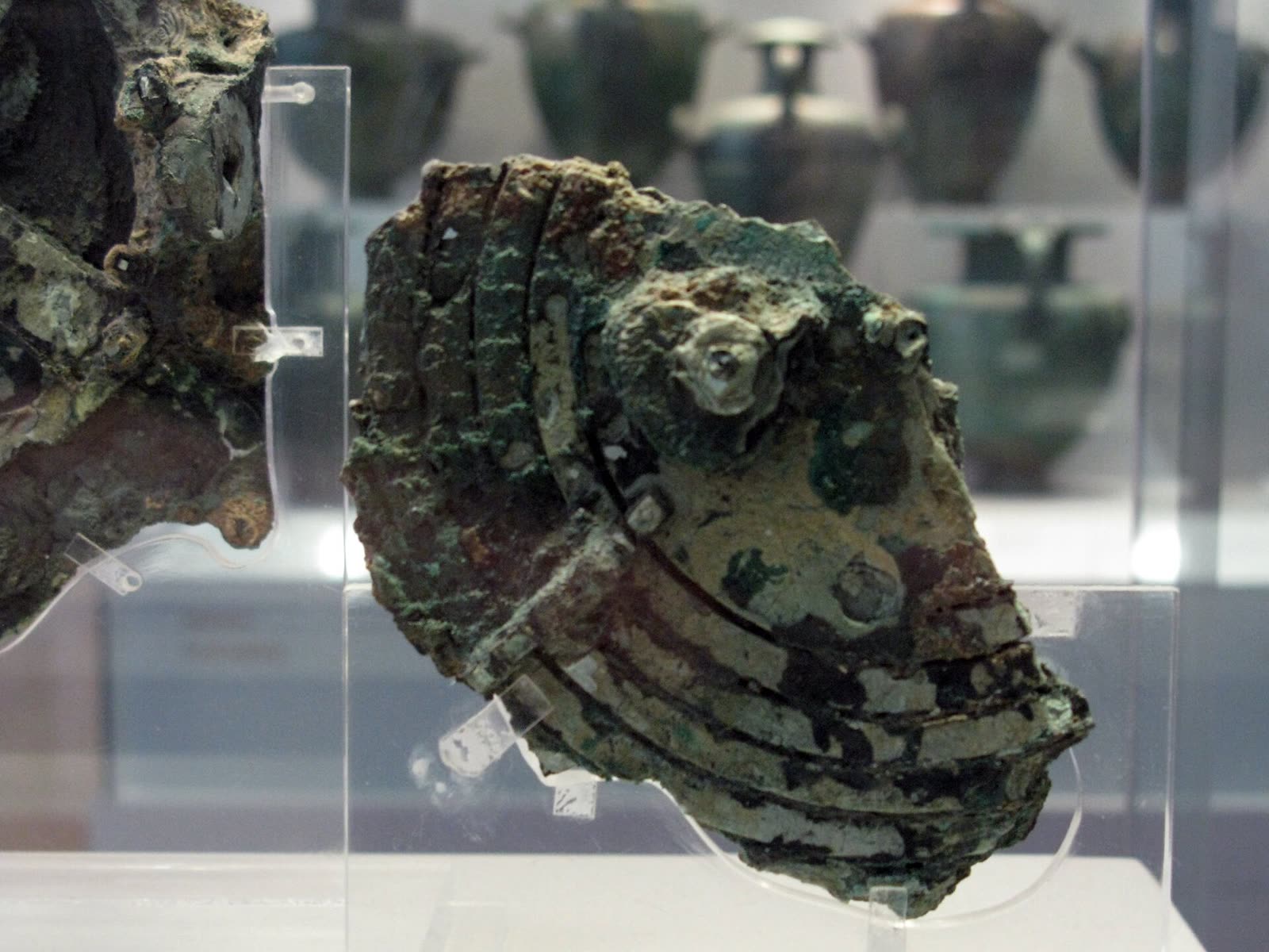 The Antikythera mechanism, an ancient Greek geared bronze device in a museum display